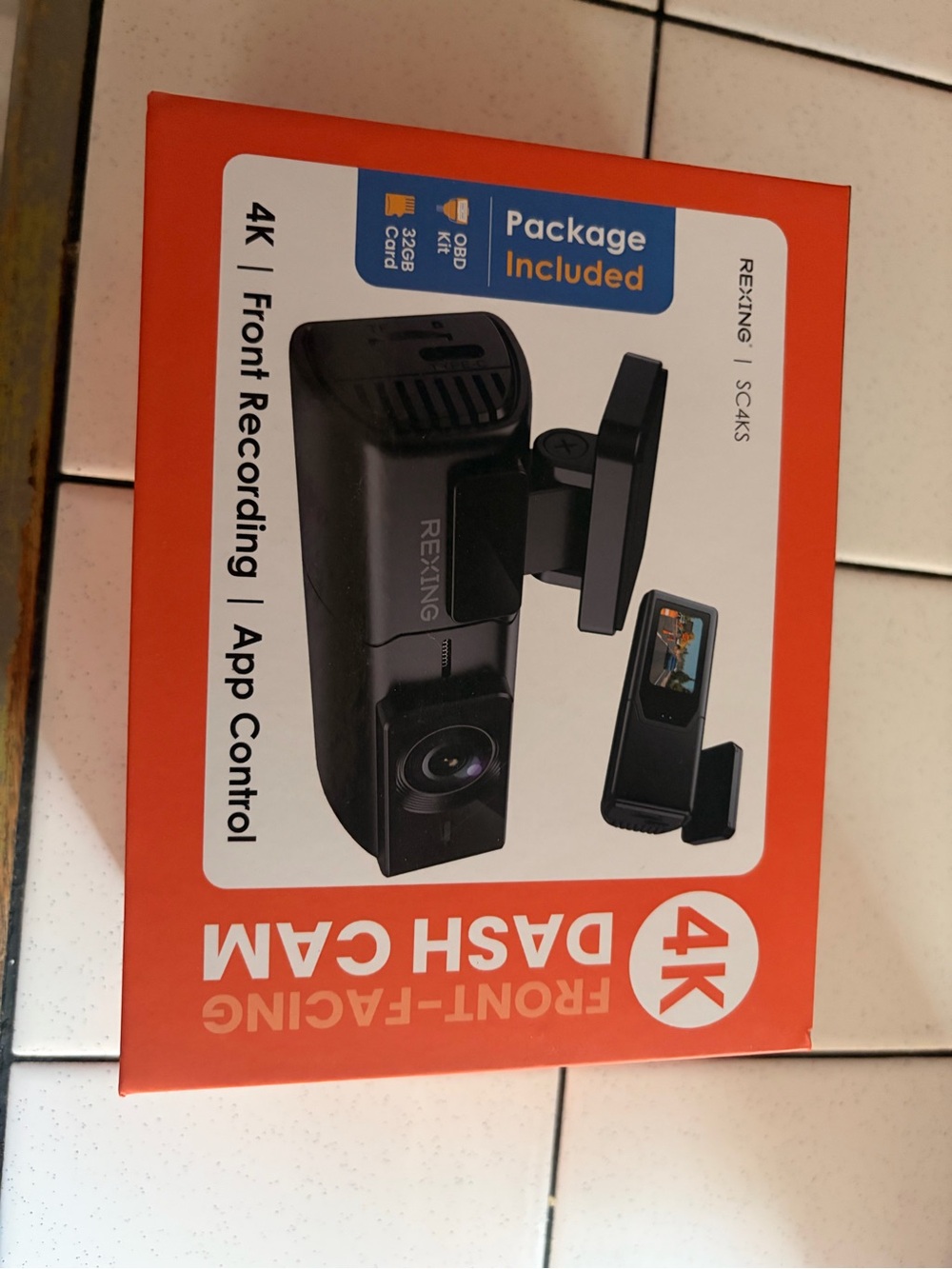 REXING 4K Front-Facing Dash Cam in Black & Orange Box